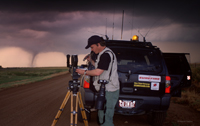 Warren Faidley filming tornadoes with 35mm camera gear